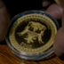 ZIMBABWE GOLD COIN logo