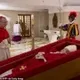coffin wif pope logo