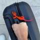 red ribbon suitcase logo