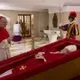 coffin wif pope logo